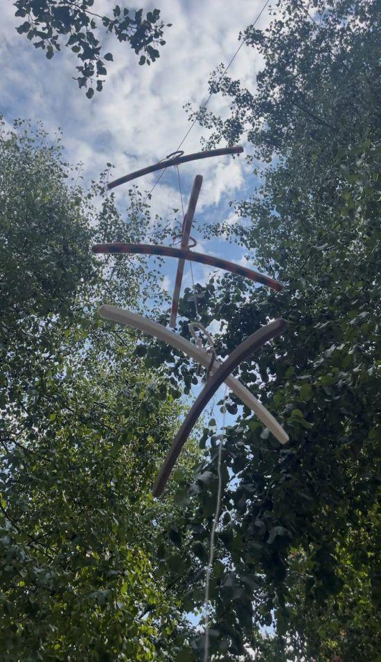 Hundreds of upcycled braided hangers suspended in trees, Arnaud Beltrame Garden, Paris Hangers and Screens